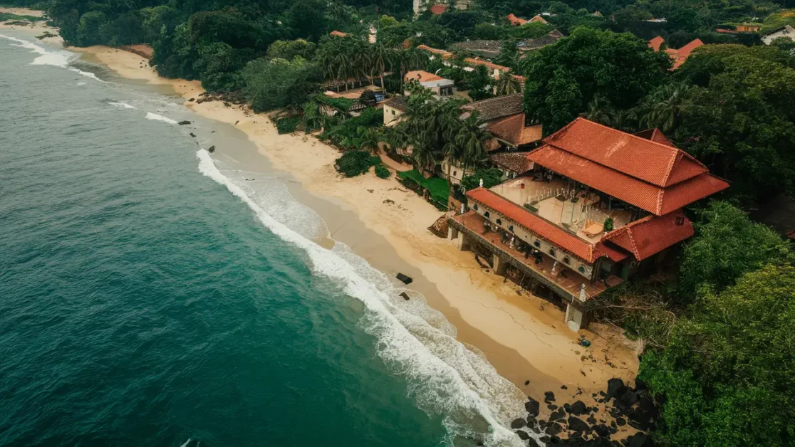 How did Portuguese colonization influence Anjuna Beach?